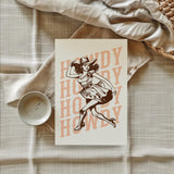 a card with a picture of a woman wearing a cowboy hat