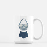 a coffee mug with a picture of a bathing suit on it