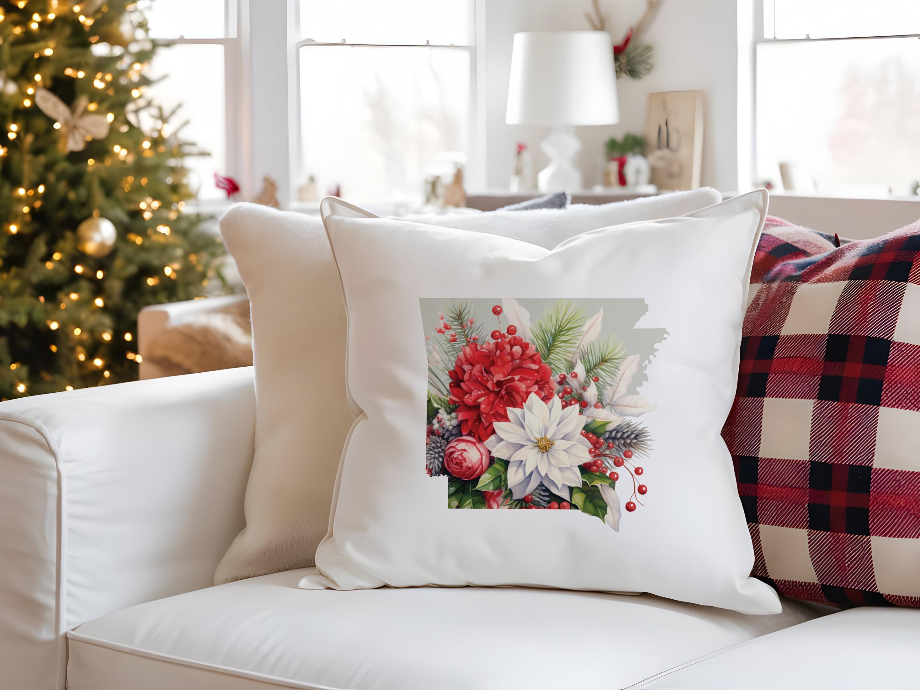 a white couch with a christmas tree in the background