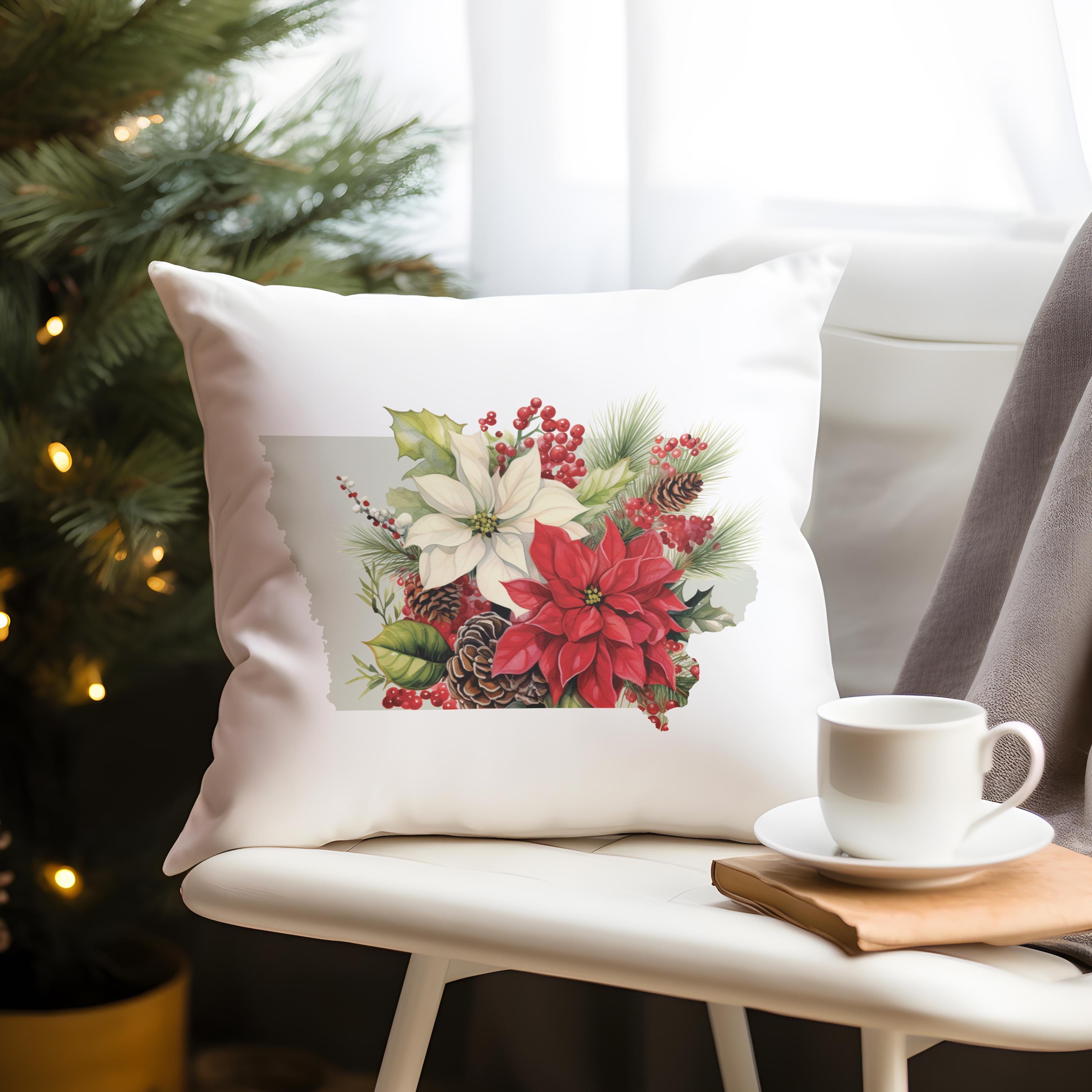 a white pillow sitting on top of a chair next to a cup of coffee