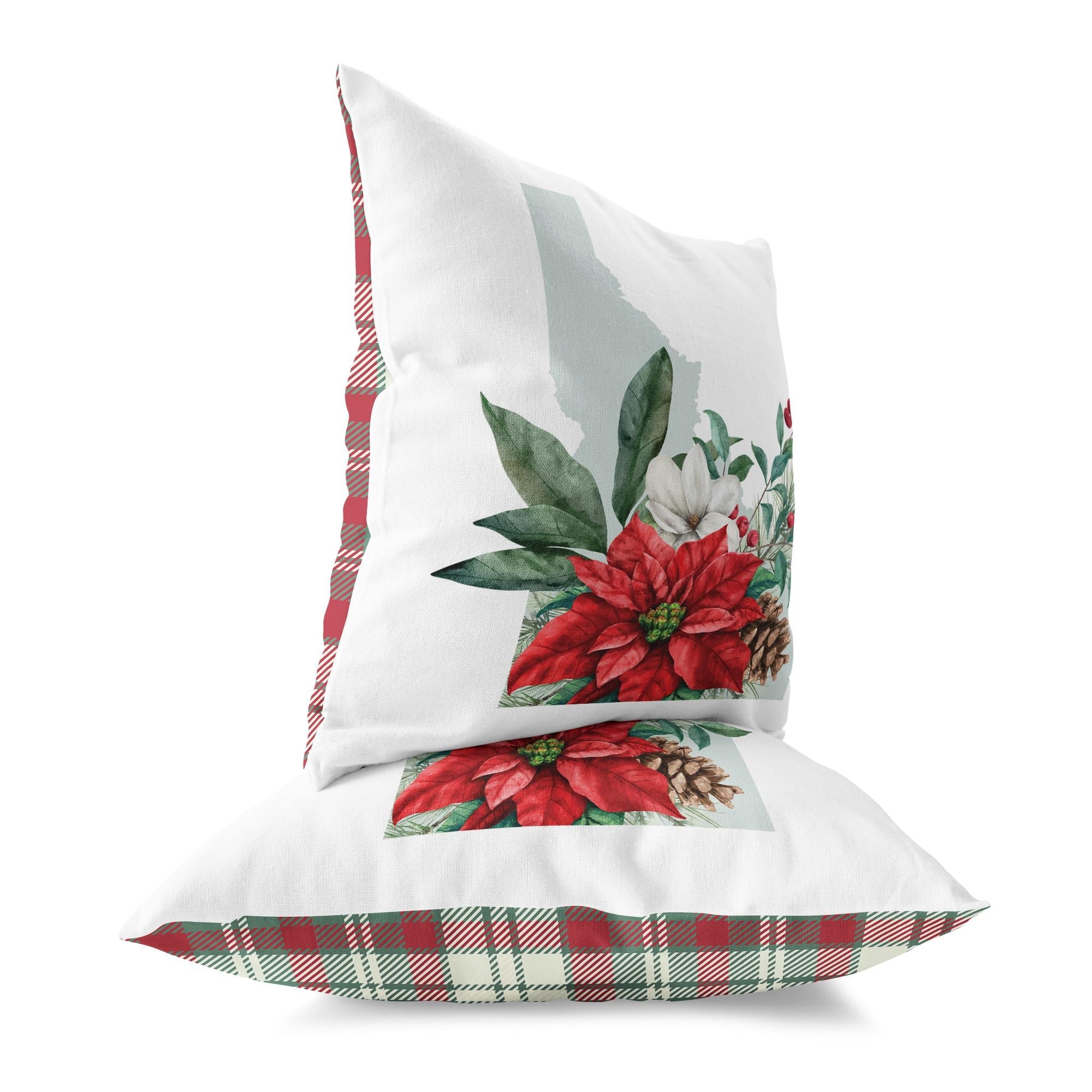 two pillows with poinsettis and pine cones on them