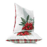 two pillows with poinsettis and pine cones on them