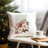 a white pillow sitting on top of a chair next to a cup of coffee