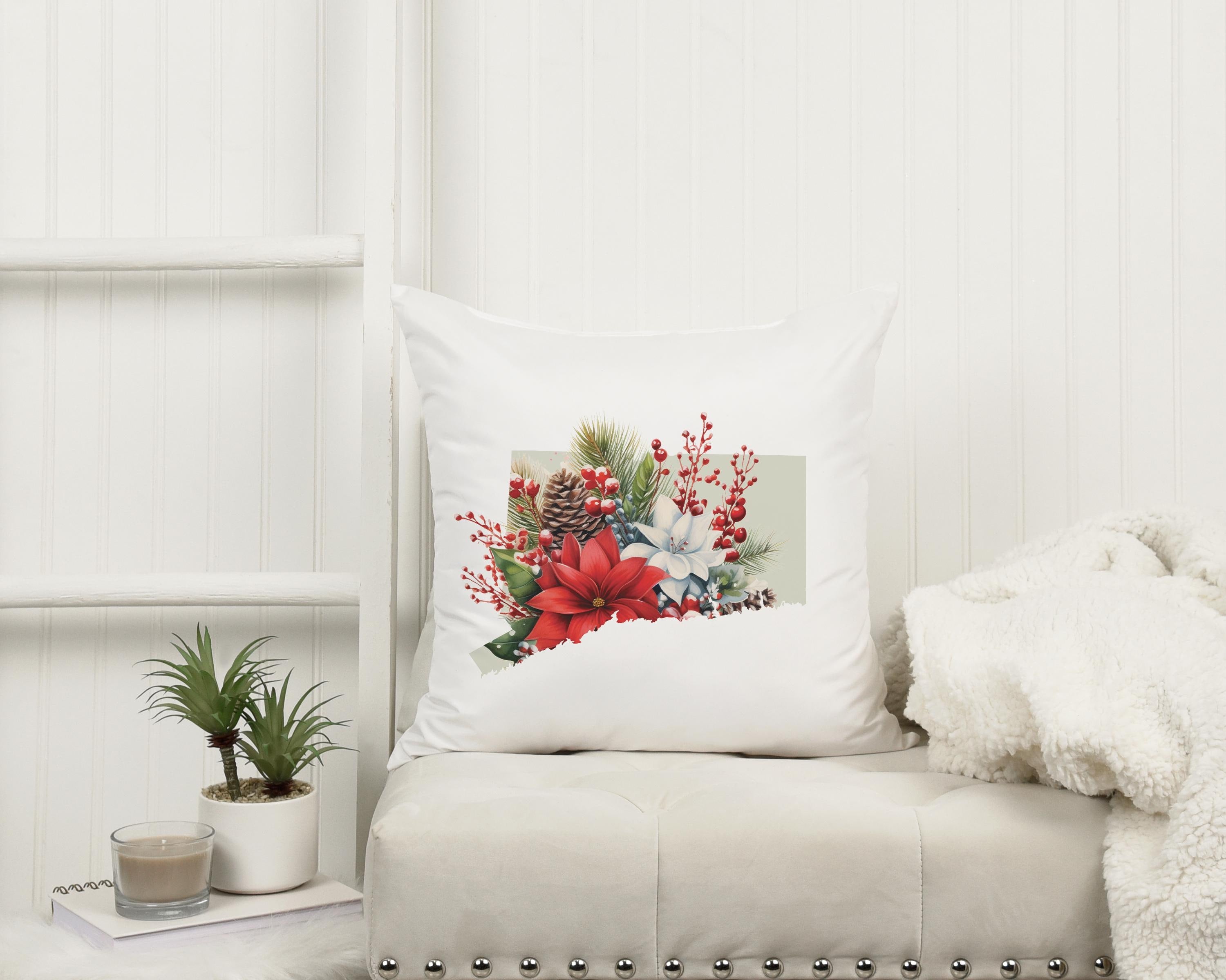 a white couch with a white pillow and a white blanket