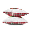 a pair of red and white pillows sitting on top of each other