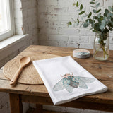Southern Cicada Tea Towel from Bloom + Bourbon Collection with vibrant cicada design.